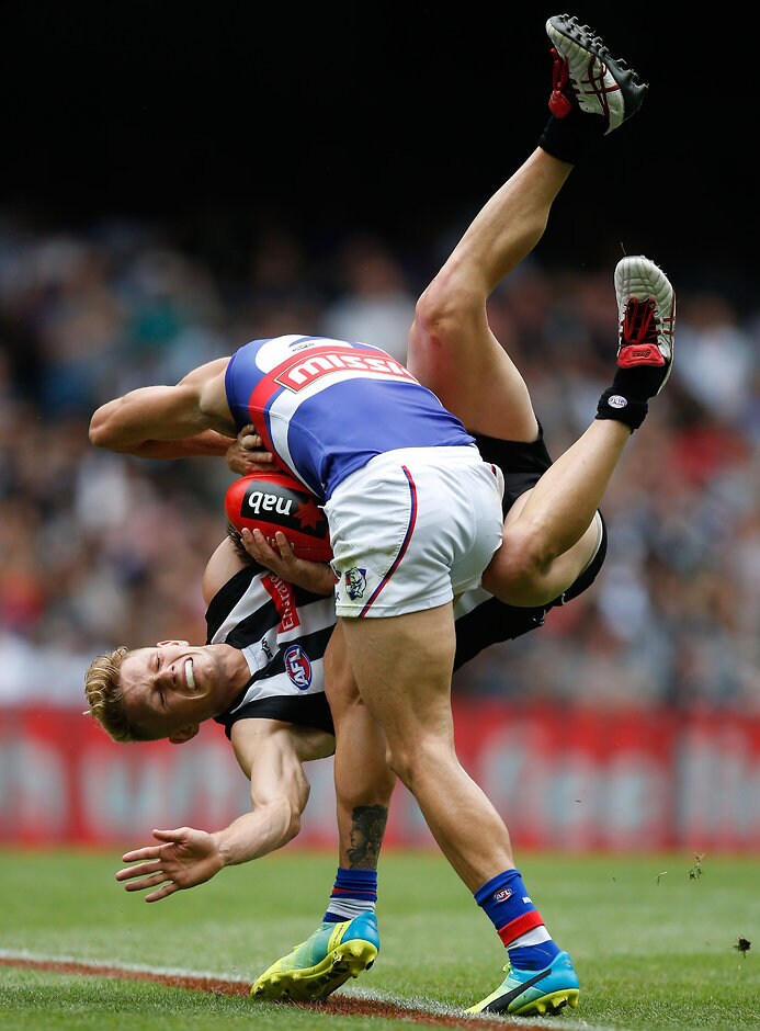 AFL 2016 NAB Challenge - Collingwood v Western Bulldogs Koby Stevens and Adam Treloar get down to it during the Magpies-Bulldogs clash - ${keywords}
